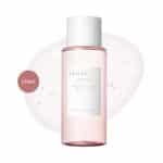 SKIN1004 Madagascar Centella Poremizing Clear Toner 210ml bottle over a bubbly liquid swatch.