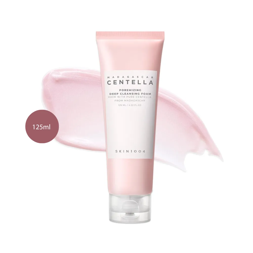 SKIN1004 Centella Poremizing Deep Cleansing Foam 125ml tube over a light pink cream swatch.