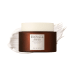 SKIN1004 Madagascar Centella Probio-Cica Enrich Cream jar over a rich cream product swatch.