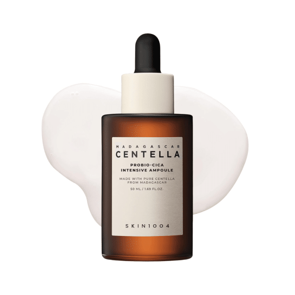 SKIN1004 Madagascar Centella Probio-Cica Intensive Ampoule bottle over a milky liquid swatch.