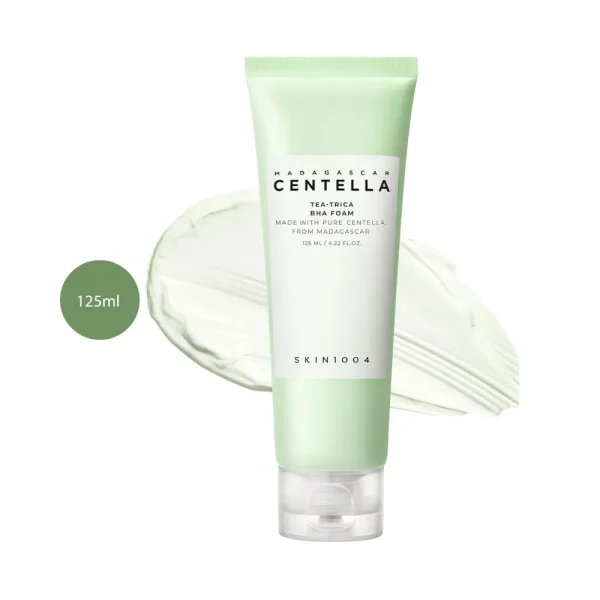 SKIN1004 Madagascar Centella Tea-Trica BHA Foam 125ml tube over green swatch.