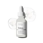The Ordinary Niacinamide 10% + Zinc 1% clear glass dropper bottle on a white background.