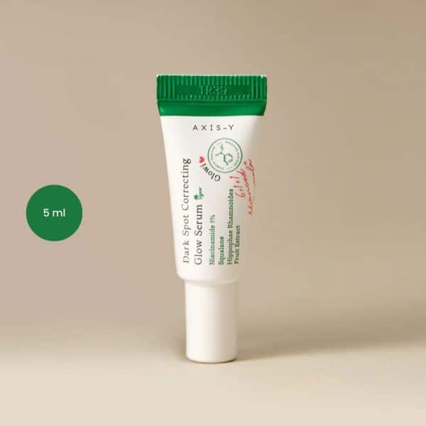 AXIS-Y Dark Spot Correcting Glow Serum 5ml mini tube with green cap and white body.