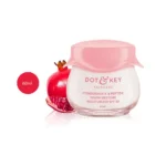 DOT & KEY Pomegranate & Peptide Anti Aging Moisturizer SPF 30 60ml jar next to a pomegranate.