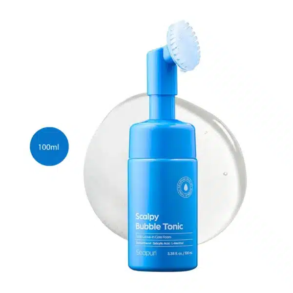 Seapuri Scalpy Bubble Tonic 100ml blue bottle with a built-in silicone brush head on a clear splash.