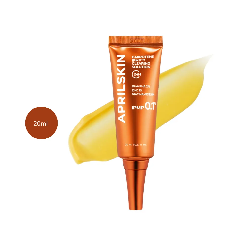 Aprilskin Carrotene IPMP Clearing Solution 20ml orange tube with yellow gel swatch behind.