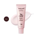 medicube Collagen Glow Sunscreen 50ml pink tube over light pink sunscreen smear.